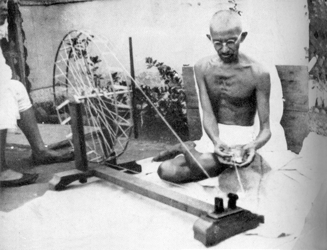 Gandhi at the spinning wheel, Sabarmati Ashram, 1925 (Source:https://www.mkgandhi.org/)